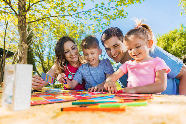 happy family playing board game